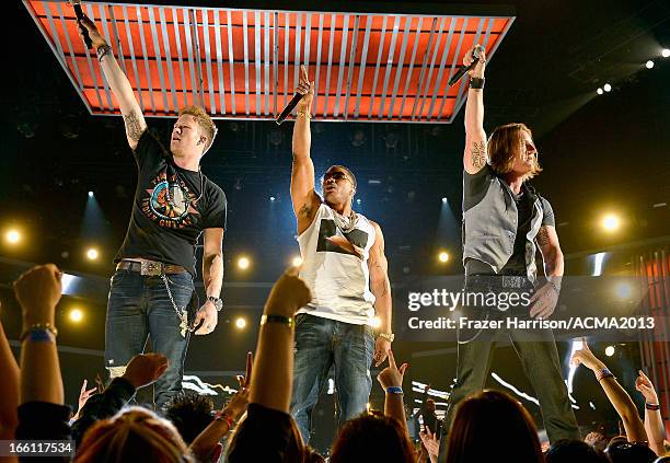 Rapper Nelly and musicians Brian Kelley and Tyler Hubbard of Florida Georgia Line perform onstage during Tim McGraw's Superstar Summer Night...