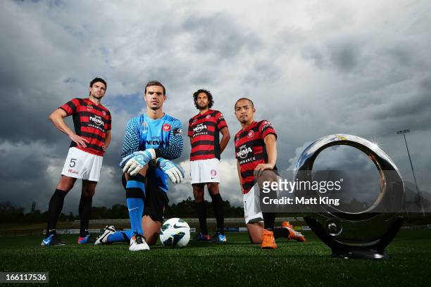 Michael Beauchamp, Ante Covic, Shinji Ono and Nikolai Topor-Stanley pose with the A-League trophy during a Western Sydney Wanderers A-League training...