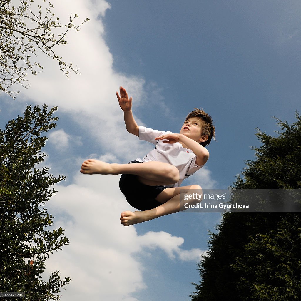 A boy jumping high