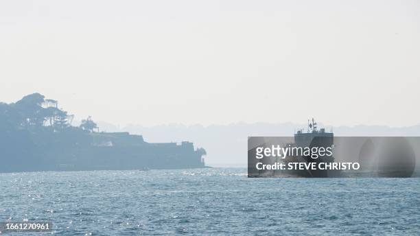 Ferry crosses Sydney's harbour while being shrouded by smoke in Sydney on September 13 as a smoky haze blankets Australia's scenic Sydney Harbour,...