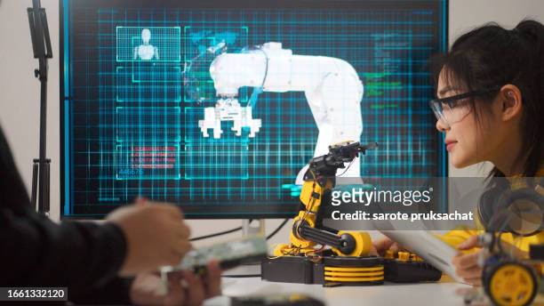 technology innovation learning  ,robotic arm. - smart factory stock-fotos und bilder