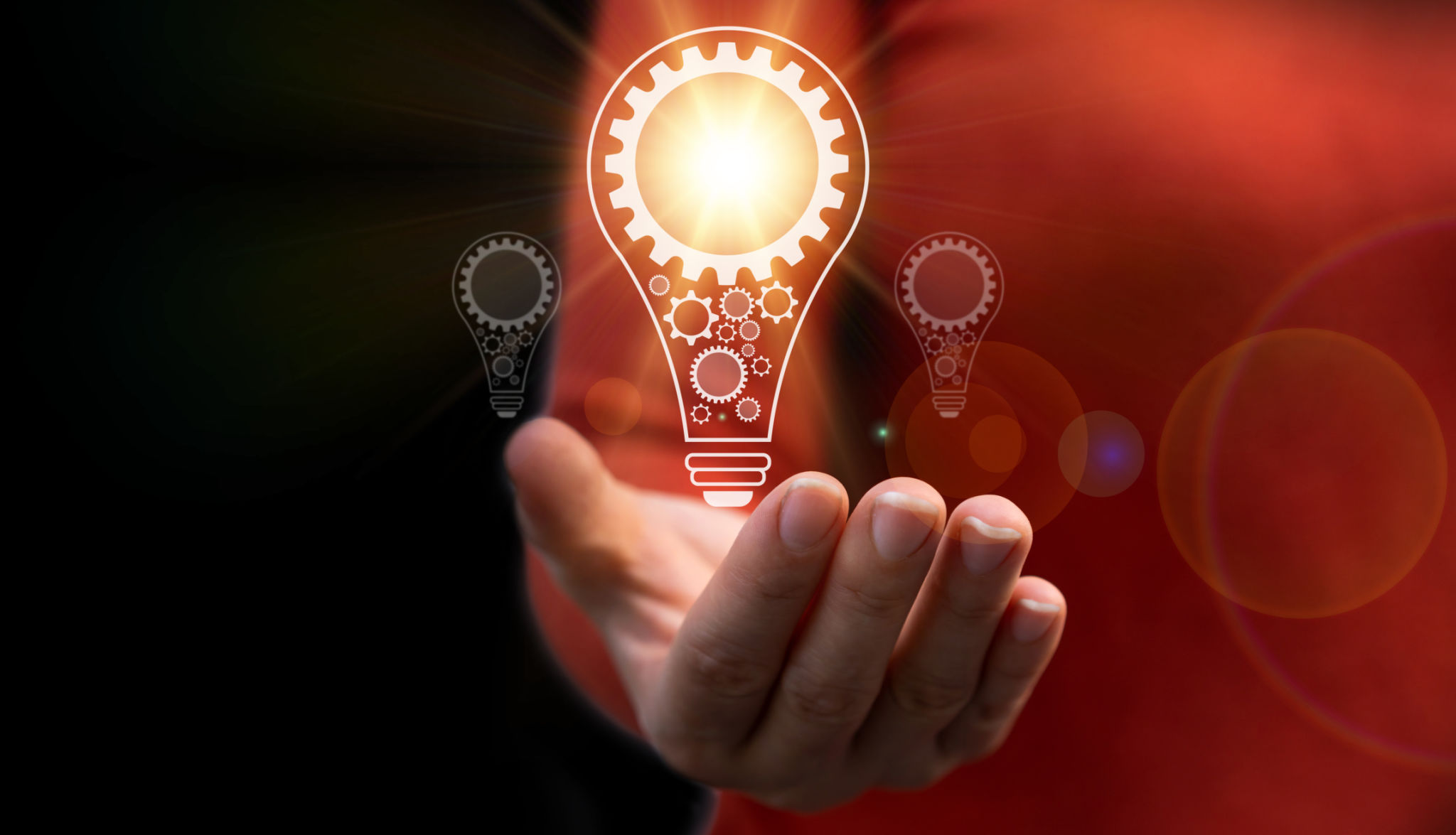 Human hand with a light bulb and gear icon.idea of ââinspiration from online technology, smart thinking brainstorming creative idea, education knowledge study and learn, innovation idea concept Human hand with a light bulb and gear icon.idea of ââinspiration from online technology, smart thinking brainstorming creative idea, education knowledge study and learn, innovation idea concept