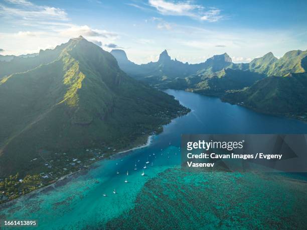 sailing boats near the moorea shore in the morning - moorea stock pictures, royalty-free photos & images