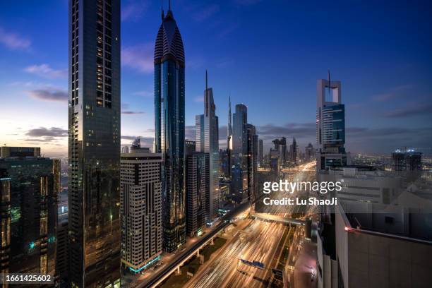 aerial view of cityscape at sunset in dubai uae - dubai stock pictures, royalty-free photos & images