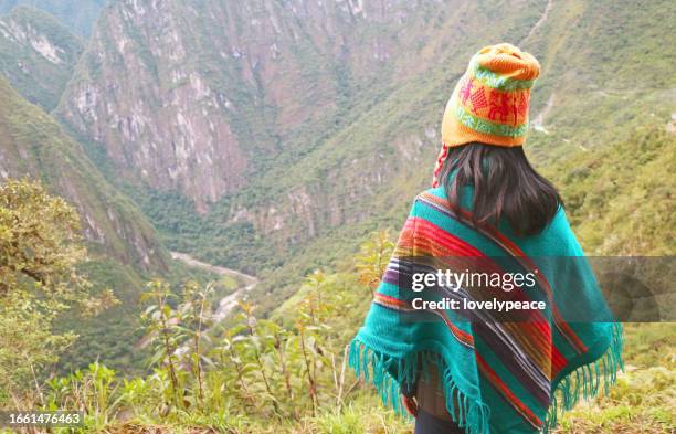 Female Visitor Enjoy a Stunning Aerial View of Aguas Calientes Town from Mt. Huayna Picchu, Machu Picchu, Cusco Region, Peru, South America