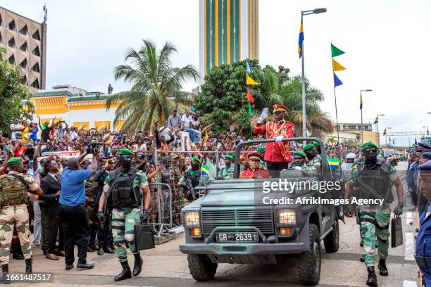 General Brice Clotaire Oligui Nguema greets the people of Gabon who came to cheer him after his inauguration as President of the Transition in Gabon,...
