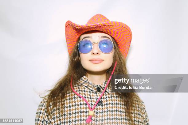 young fashionable woman posing in cowboy hat - retro cowgirl stock pictures, royalty-free photos & images