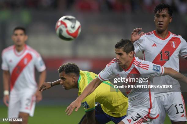 Brazil's forward Rodrygo fights for the ball with Peru's defender Aldo Corzo during the 2026 FIFA World Cup South American qualifiers football match...