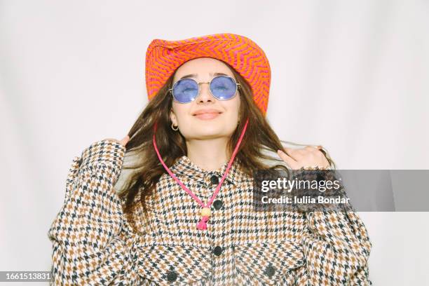 young fashionable woman posing in cowboy hat - retro cowgirl stock pictures, royalty-free photos & images