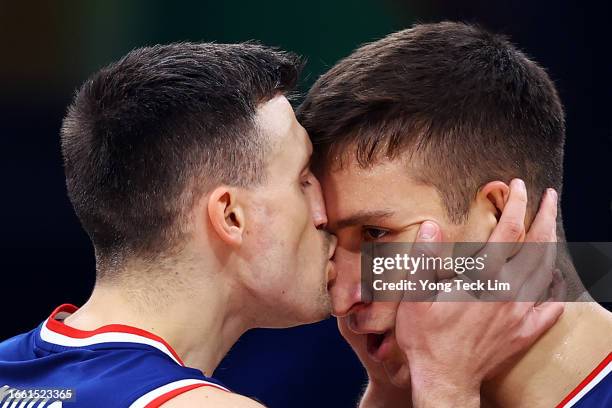 Bogdan Bogdanovic of Serbia celebrates with Aleksa Avramovic at the end of the second quarter during the FIBA Basketball World Cup quarterfinal game...
