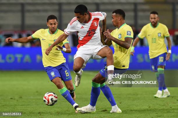 Peru's forward Joao Grimaldo fights for the ball with Brazil's defender Renan Lodi and defender Gabriel Magalhaes during the 2026 FIFA World Cup...