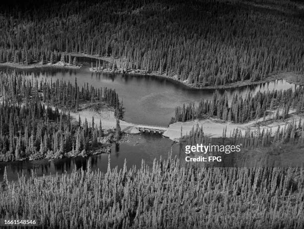 High-angle view of the Alaska Highway during its construction, cut through the Alaskan wilderness, Alaska, circa 1941.
