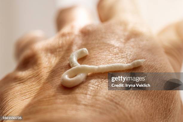 hand with smear of organic moisturizing facial cream or hand cream. routine step for healthy skin care. - retinol stock pictures, royalty-free photos & images