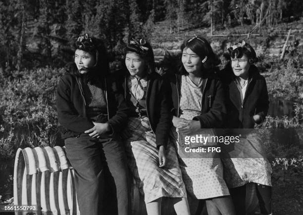 Four Inupiat girls on the Alaska Highway in Alaska, July 1949.