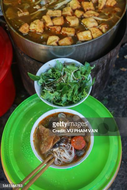 hue-style vegetarian noodle soup sold in hue city, vietnam - vietnamese mint stock pictures, royalty-free photos & images
