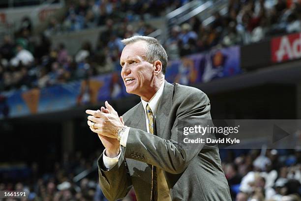 Head coach Doug Collins of the Washington Wizards coaches from the sideline during the game against the Cleveland Cavaliers at Gund Arena on November...