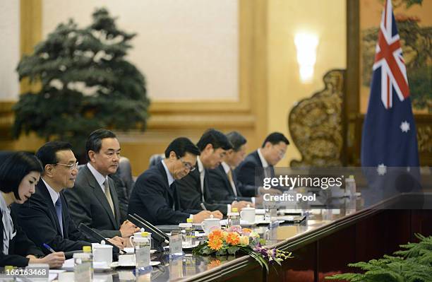 Chinese Premier Li Keqiang speaks with Australia Prime Minister Julia Gillard during a meeting at the Great Hall of the People on April 9, 2013 in...