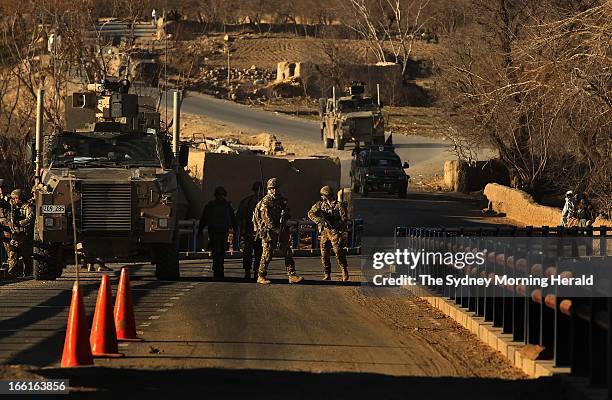 Australian soldiers search for IEDs at the Puza Bridge in Dai Roshan, Uruzgan Province, Afghanistan, January 24, 2013. An insurgent was arrested in...