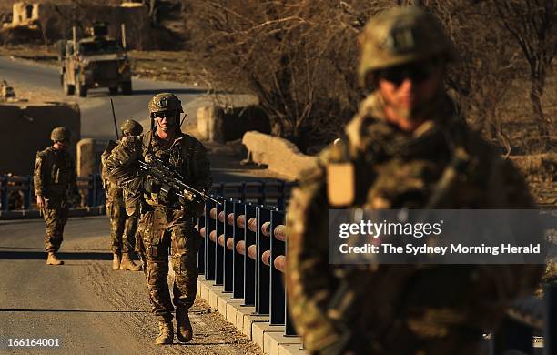 Australian soldiers search for IEDs at the Puza Bridge in Dai Roshan, Uruzgan Province, Afghanistan, January 24, 2013. An insurgent was arrested in...
