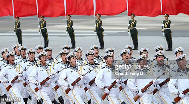 Honour guard troops march during a welcome ceremony for Australia's Prime Minister Julia Gillard outside the Great Hall of the People on April 9,...