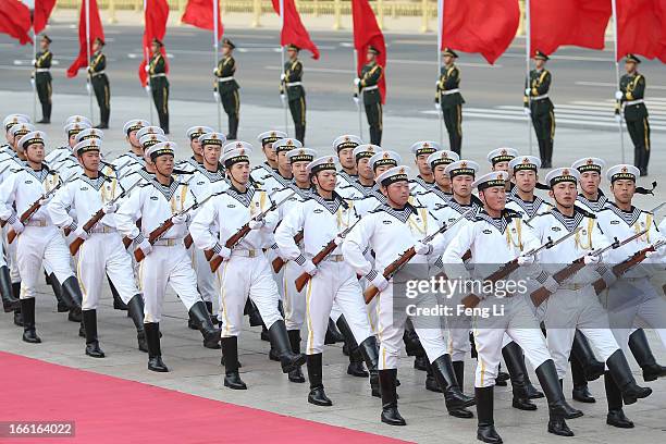 Honour guard troops march during a welcome ceremony for Australia's Prime Minister Julia Gillard outside the Great Hall of the People on April 9,...