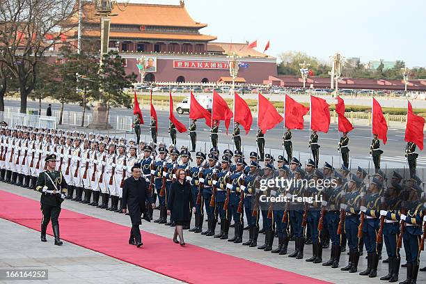 Chinese Premier Li Keqiang accompanies Australian Prime Minister Julia Gillard to view an honour guard during a welcoming ceremony outside the Great...