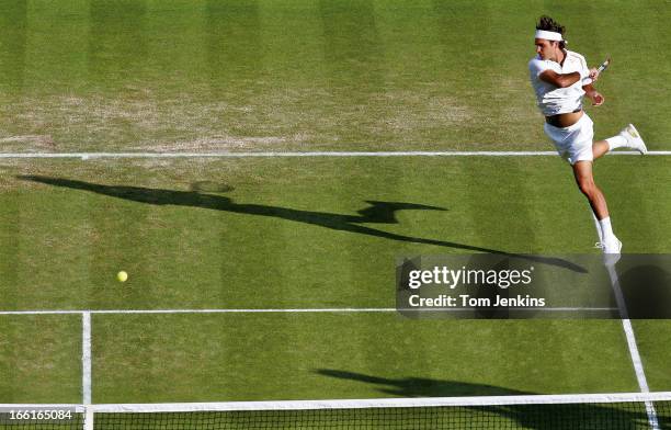 Roger Federer of Switzerland plays a forehand during his victory over Marat Safin of Russia in the men's singles tournament at Wimbledon on June 29th...