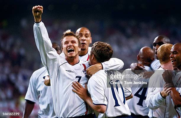 David Beckham joins his England team mates as they celebrate a goal against Denmark in their FIFA World Cup last sixteen match with Denmark at the...