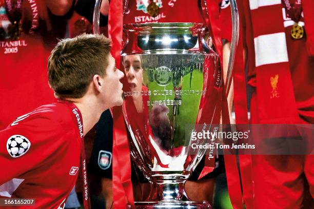 Liverpool captain Steven Gerrard kisses the winner's trophy at the presentation after his side beat AC Milan on penalties at the Champions League...