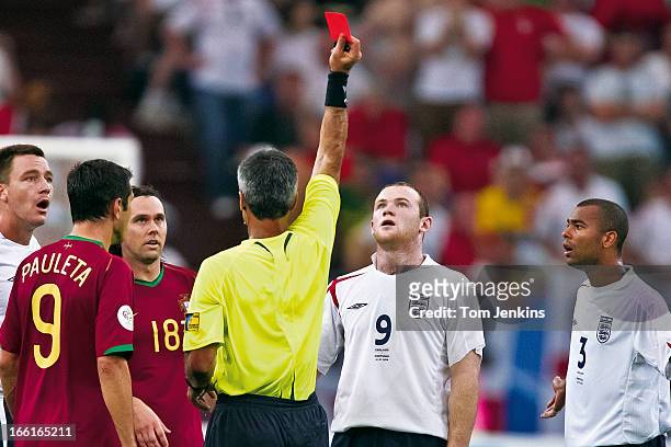 England's Wayne Rooney looks up at the red card as he is sent off by referee Horacio Elizondo during the England v Portugal FIFA World Cup...