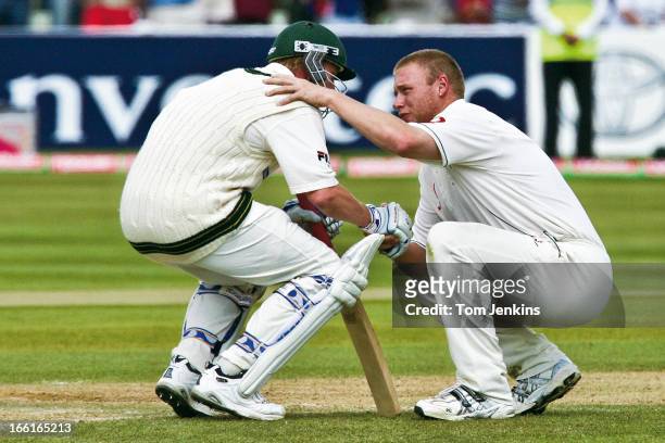 Andrew Flintoff of England consoles Brett Lee of Australia after England won the 2nd Ashes Test Match by two runs at the Edgbaston cricket ground on...