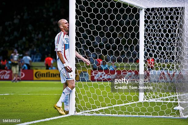 Zinedine Zidane of France walks straight into a goal-post as he shows frustration in extra-time during the 2006 FIFA World Cup Final France versus...