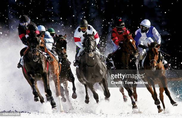 Horses and riders competing in the annual White Turf horse race meeting held on the frozen St. Moritz lake on February 12th 2006 in St. Moritz,...
