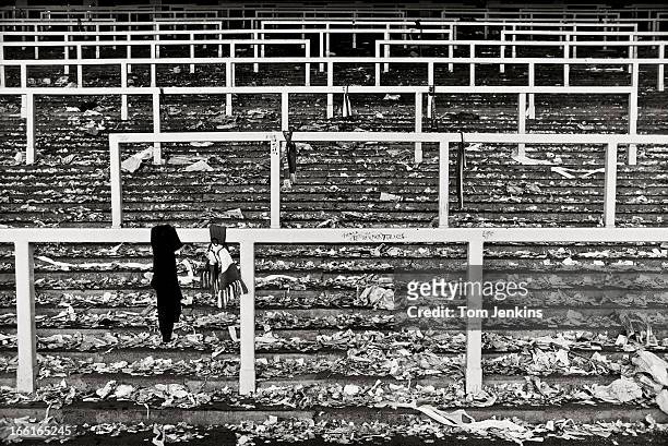 Debris and mementos left by Liverpool fans on the Kop standing area after the final game before it was demolished and replaced with seats following...