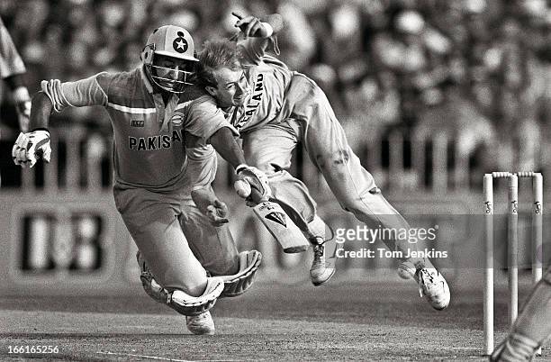 Wasim Akram of Pakistan collides with Wasim Akram of New Zealand during the 1992 Cricket World Cup semi-final match New Zealand versus Pakistan at...