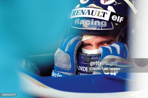 Damon Hill of Great Britain, waits in his Williams Formula One car during qualifying practice for the 1995 British Grand Prix at the Silverstone...