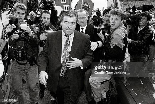 Terry Venables is surrounded by members of the press as he leaves the White Hart Lane stadium after being sacked as manager by Tottenham Hotspur...