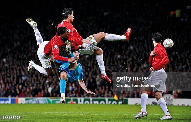 Patrice Evra and Cristiano Ronaldo of Manchester United compete with Deco of Barcelona during the Manchester United versus Barcelona Champions League...