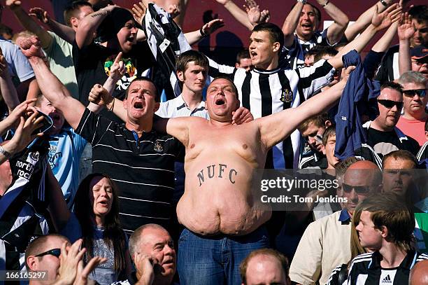 Newcastle United fans sing despite suffering relegation from the Premier League after defeat to Aston Villa at Villa Park on May 24th 2009 in...