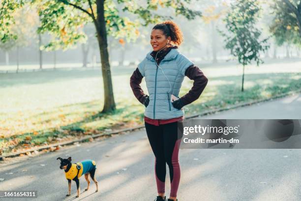 Sportswoman Taking A Breath After Jogging, Stockfoto