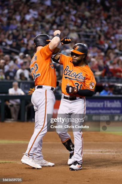 Cedric Mullins of the Baltimore Orioles celebrates with Ryan O'Hearn after hitting a three-run home run against the Arizona Diamondbacks during the...