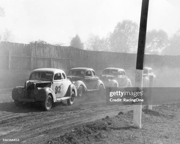 Early-1950s: A group of Modified-Sportsman stock cars negotiate a turn at the Greensboro Fairgrounds.