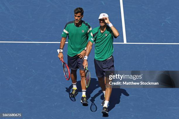 Andres Molteni and Maximo Gonzalez of Argentina look on against Rajeev Ram of the United States and Joe Salisbury of Great Britain during their Men's...