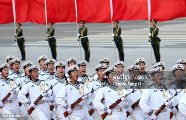 Honour guard troops march during a welcome ceremony for Australia's Prime Minister Julia Gillard outside the Great Hall of the People on April 9,...