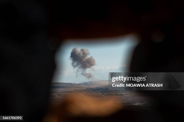 Idlib, Syria. Smoke rises as a result of warplanes and artillery shelling on villages near the contact lines with the Syrian regime forces in Jabal...