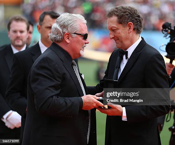 General manager Brian Sabean of the San Francisco Giants receives his 2012 Championship Ring from President and Chief Executive Officer Larry Baer...