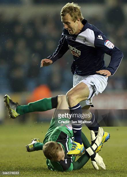 Rob Hulse of Millwall is tackled by Chris Kirkland of Sheffield Wednesday during the npower Championship match between Millwall and Sheffield...