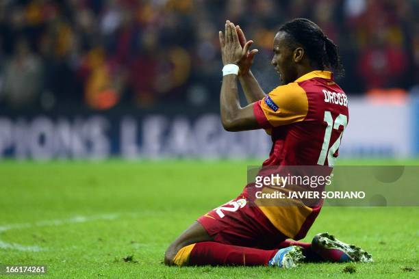Galatasaray's Ivorian forward Didier Drogba gestures on April 9, 2013 during a UEFA Champions League quarter-final, second leg football match against...