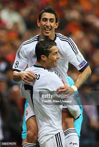 Cristiano Ronaldo of Real Madrid celebrates scoring the opening goal with Angel Di Maria during the UEFA Champions League quarter-final second leg...