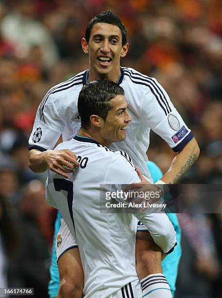 Cristiano Ronaldo of Real Madrid celebrates scoring the opening goal with Angel Di Maria during the UEFA Champions League Quarter Final match between...